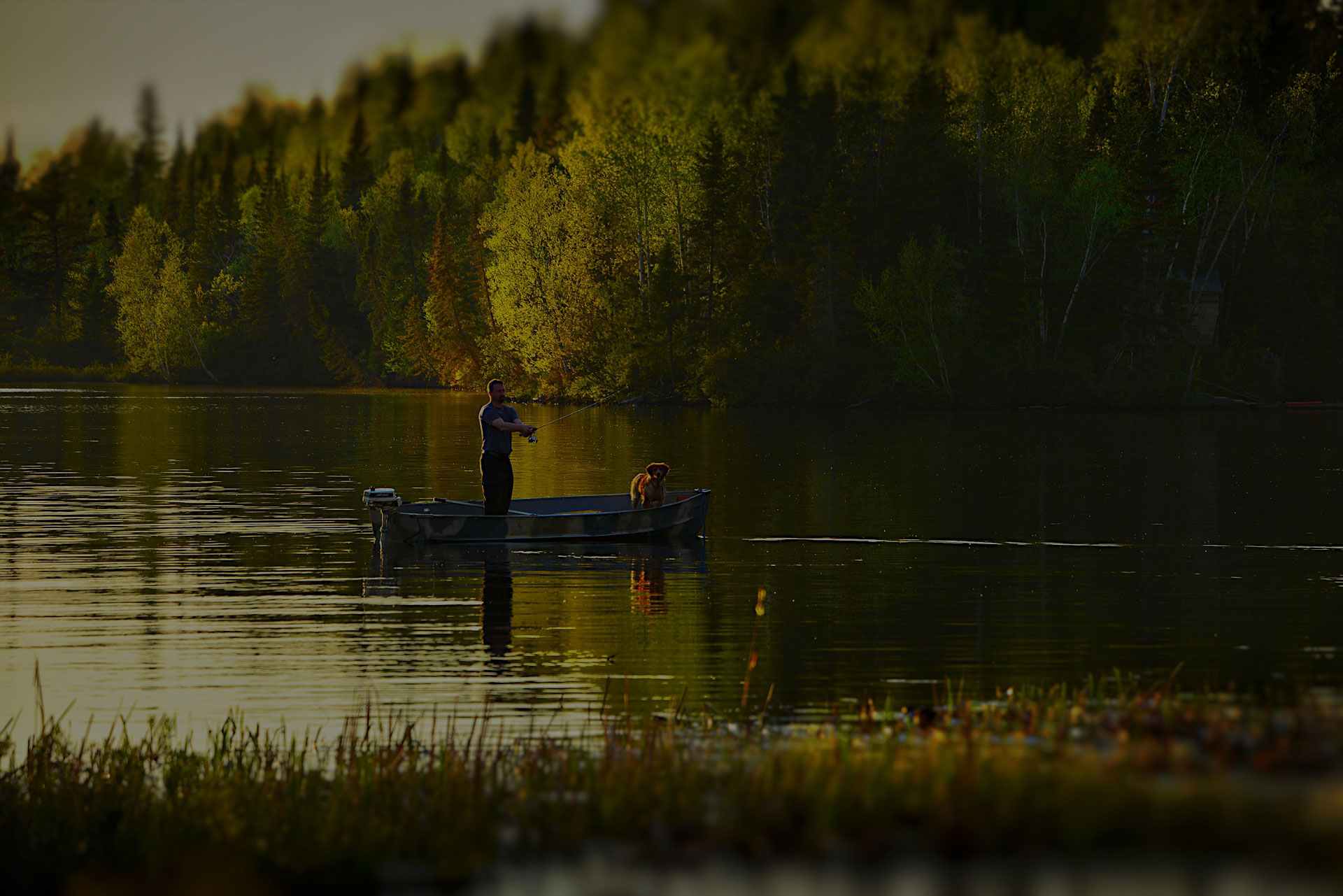 Men in boat with dog